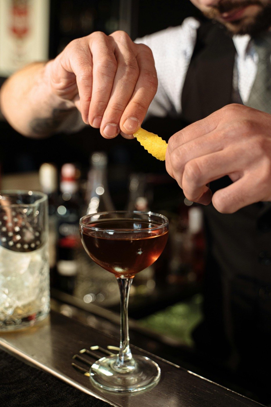 Bar Hijack mixologist pouring a cocktail